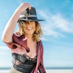 Portrait of Zoryana Klymchuk, a yoga practitioner, smiling warmly.